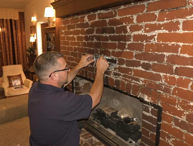 Torrance Chimney Sweep expert fixing a fireplace in Torrance, CA